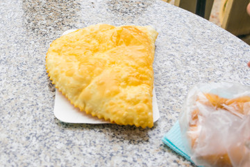 Cheburek is on the table.
