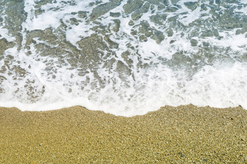 Wave on the rocky shore.