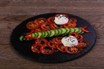 Kids salad with tomato, cucumber