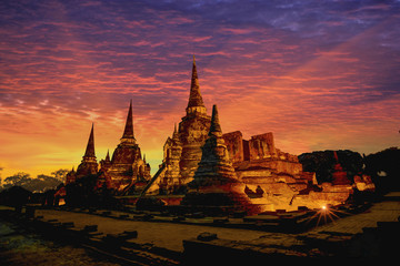 The ruins of the old temple in Ayutthaya historical park at sunset, Ayutthaya, Thailand - obrazy, fototapety, plakaty