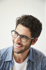 Obraz premium Happy guy in spectacles, looking away