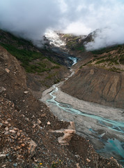 A river of milky blue water flows off the melting Gangapurna glacier