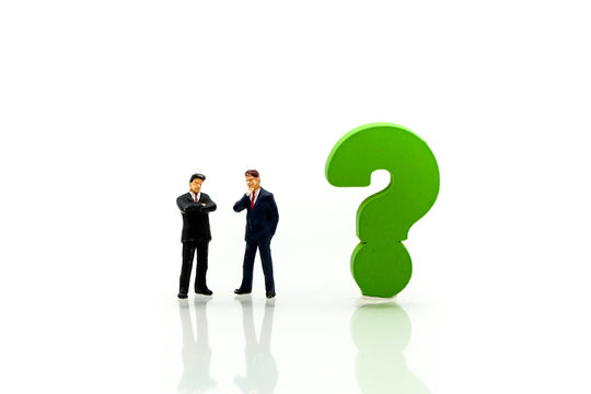 Miniature people : Businessman with THE QUESTION MARK using for concept Punctuation Day