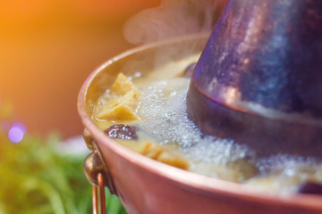Chinese traditional hot pot close-up. Toned photo
