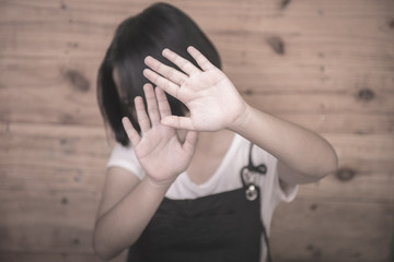 Girls raise their hands to show anti-cruelty to children and women