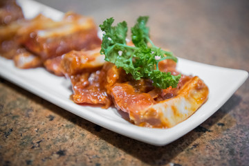 Japanese style pork ribs in white plate
