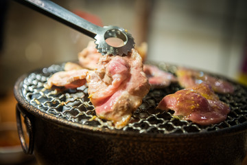 pork slice grilled on stove which has hot charcoal. Barbecue Japanese style.