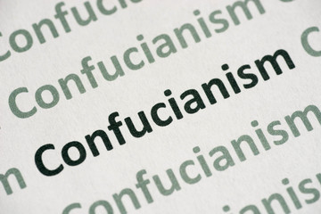 Obraz premium word Confucianism printed on paper macro