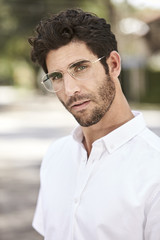 Portrait of glasses guy in white shirt