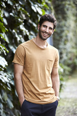 Smiling guy in t-shirt, looking away