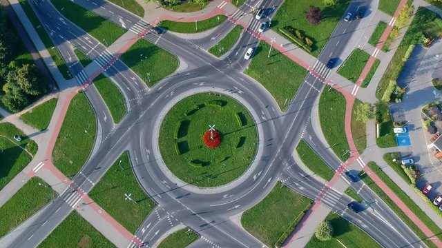 Aerial footage, roundabout intersection in city.