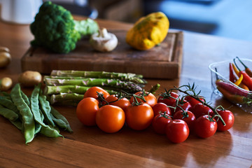 Rustic kitchen table with different fresh farm vegetables. Autumn harvest and healthy organic food concept.