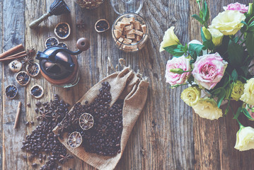 Roasted coffee beans in toned vintage setting.