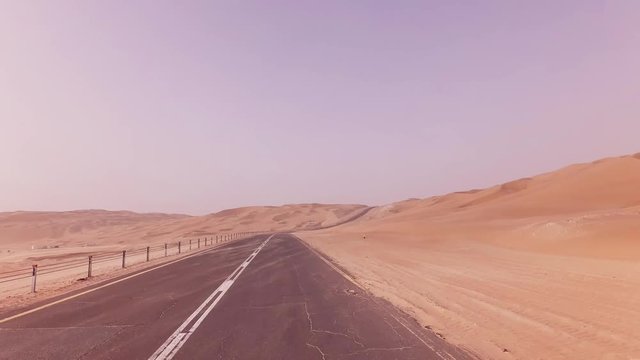 New road from Oasis Liwa to Moreeb Dune in Rub al Khali desert stock footage video