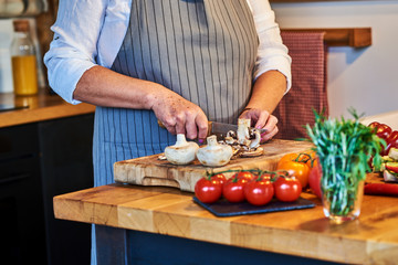Preparing vegetables. Senior woman hands.