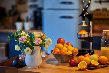 Orange juice freshly squeezed from fresh fruits with a juicer.