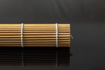 Bamboo Mat on a black matte table