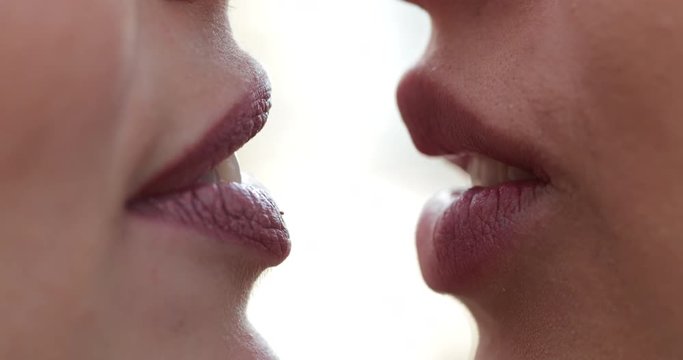 Close-up of women lips smiling and talking to each2