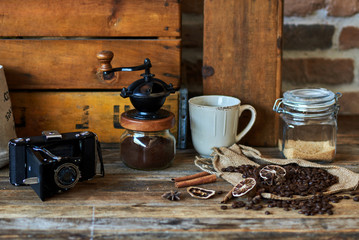 Old retro camera  and cup of coffee in coffee shop vintage color. Retro style. Vintage.