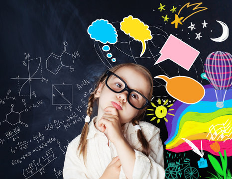 Smart kid with speech bubbles and colorful creative design elements and science formulas on chalk board
