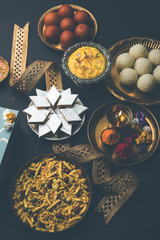 Raksha bandhan greetings : Sweet food like Gulab Jamun, Rasgulla, Shrikhand, Bundi Laddu, Kaju Katli and farsan with Pooja thali for Rakhi Festival Celebration