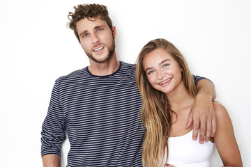 Fototapeta premium Handsome couple in white studio, portrait