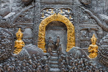 Fototapeta na wymiar Thai style silver carving art on temple wall , Wat Srisuphan ,Chiang Mai, Thailand.