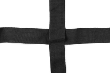 Black synthetic nylon fastening belt, strap isolated on white background, top view