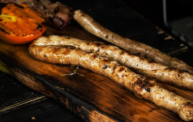 Grilled pork sausages with baked vegetables