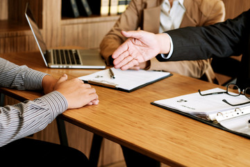 Examiner reading a resume during job interview at office Business and human resources concept