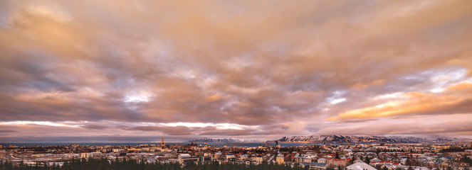 Banner: dramatic sunset sky over Reykjavic, Iceland