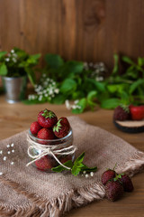 Fototapeta na wymiar Lots of fresh bright red strawberries. Selective focus.