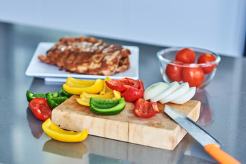  Vegetables and meat on table.