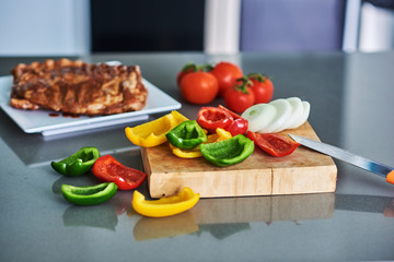Vegetables fresh tomato,onion, peppers on cutting board.