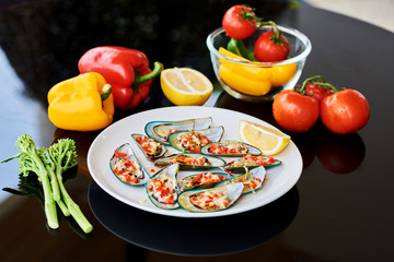 Yummy mussels under cheese and lemon