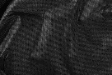 Synthetic black nylon fabric, cloth texture background
