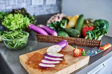 Vegetables on a cutting board. Domestic kitchen, closeup photography of the cooking process. Raw food imagery.