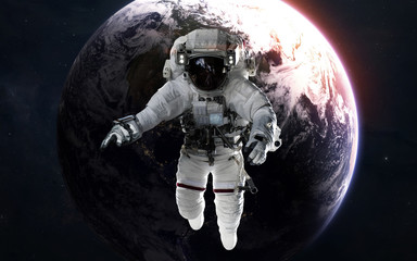 Earth with astronaut in front of planet. Solar system. Elements of this image furnished by NASA