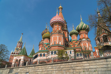 Fototapeta na wymiar Red square. St. Basil's Cathedral on the background of the Kremlin Spasskaya tower.