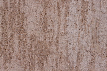 Brown plastered handmade rough wallpaper. Beautiful decorative plastered wall. Rough texture.