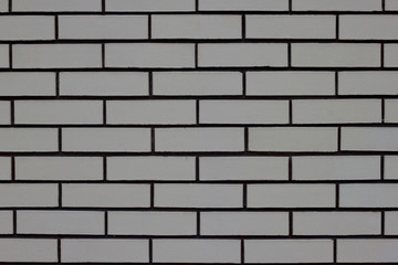 Fragment of gray brick house wall. Copy space for your text.