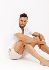 Obraz premium Sexy Male Model Isolated On White