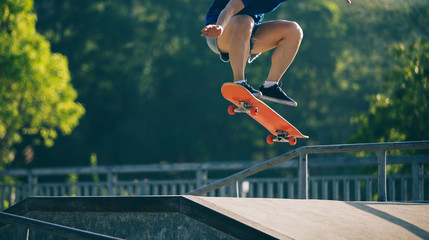 skateboarder skateboarding on skatepark ramp © lzf