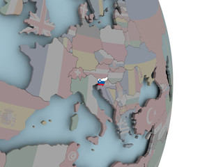 Map of Slovenia on political globe with flag