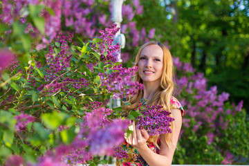Model in garden with lilac