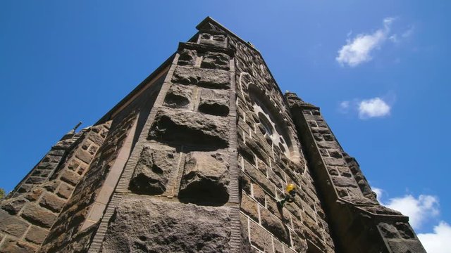 Dolly shot of blue-stone Anglican church in Australia.