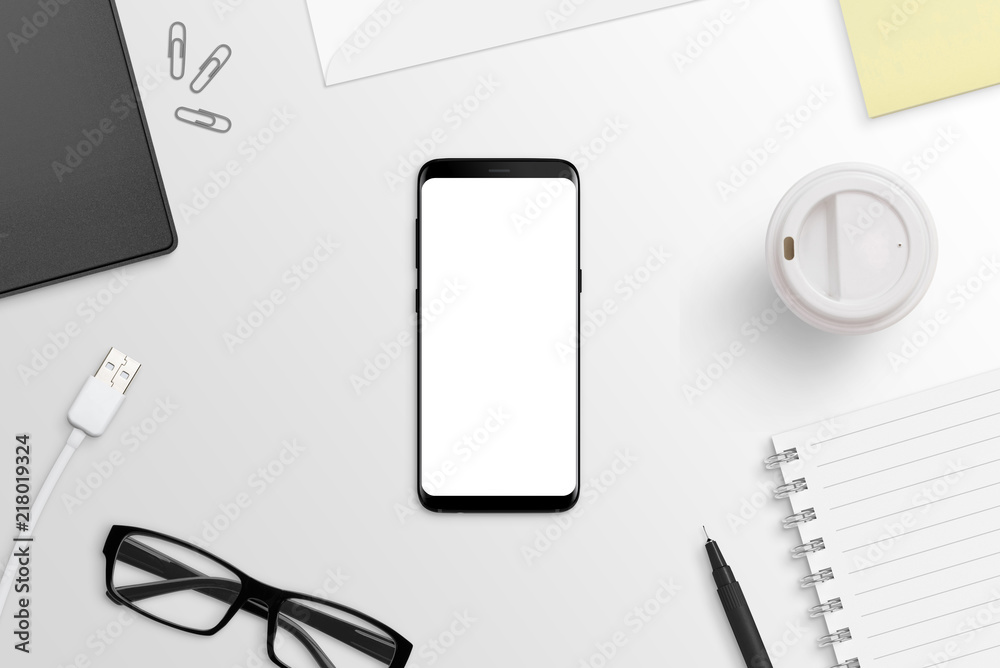 Poster Phone with round edges on white desk. Isolated screen for app or web site presentation mockup. Flat lay. Top view.