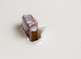 Chocolate falls in milk