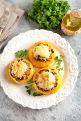 Organic yellow patissons stuffed with meat, onions, carrots, mushrooms and red pepper baked in the oven with cheese.