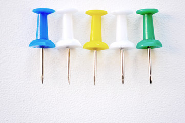 Multi Colored Push Pins, needles on white background